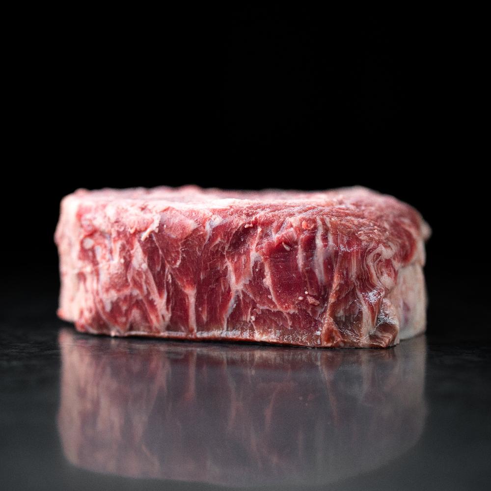 American Wagyu cowboy ribeye steak with impressive bone-in presentation, rich marbling, and bold flavor - perfect for grilling