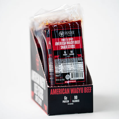 Packaged American Wagyu beef snack sticks with branding on a white background